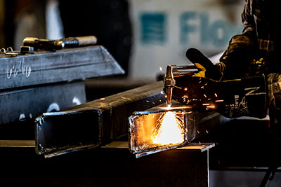 Greer Custom Structural & Metal Fabrication - Torch cutting Steel