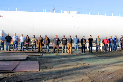 Greer Tank Fairbanks - Photo of Team next to large steel tank