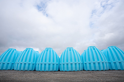 Underground plastic water tanks in the Greer yard.